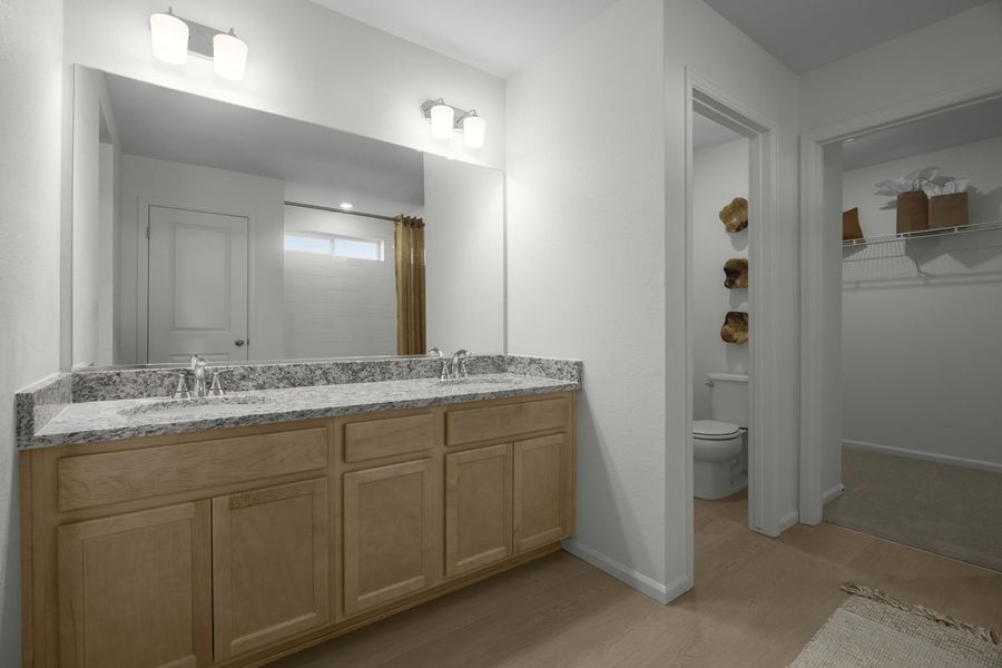 Dual-sink vanity at primary bathroom