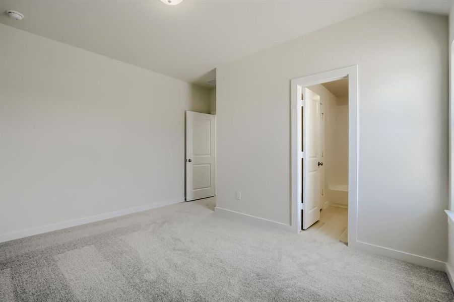 Neutral carpet flooring and light-toned walls