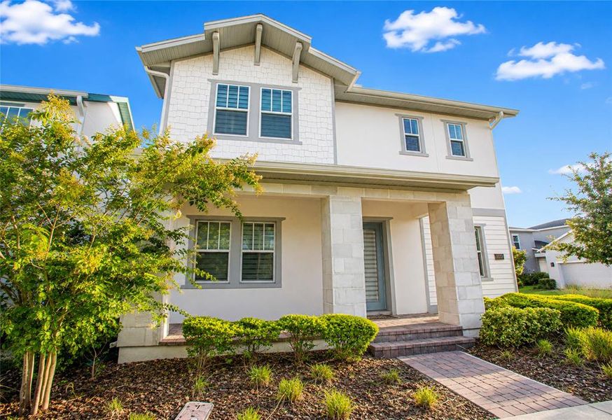 Front exterior of a new home in , Orlando, FL, highlighting curb appeal (Image 25).