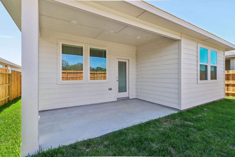 Exterior details and patio area of a home in Sanford Farms - Traditional Series, Conroe (Image 4).