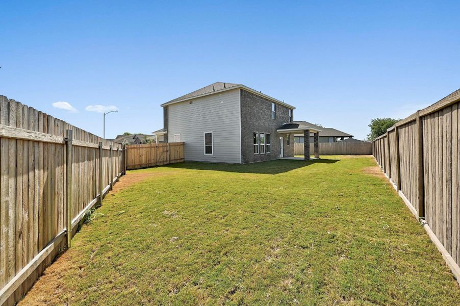 Front exterior of a new home in Centerpoint Meadows, Lockhart, TX, highlighting curb appeal (Image 18).