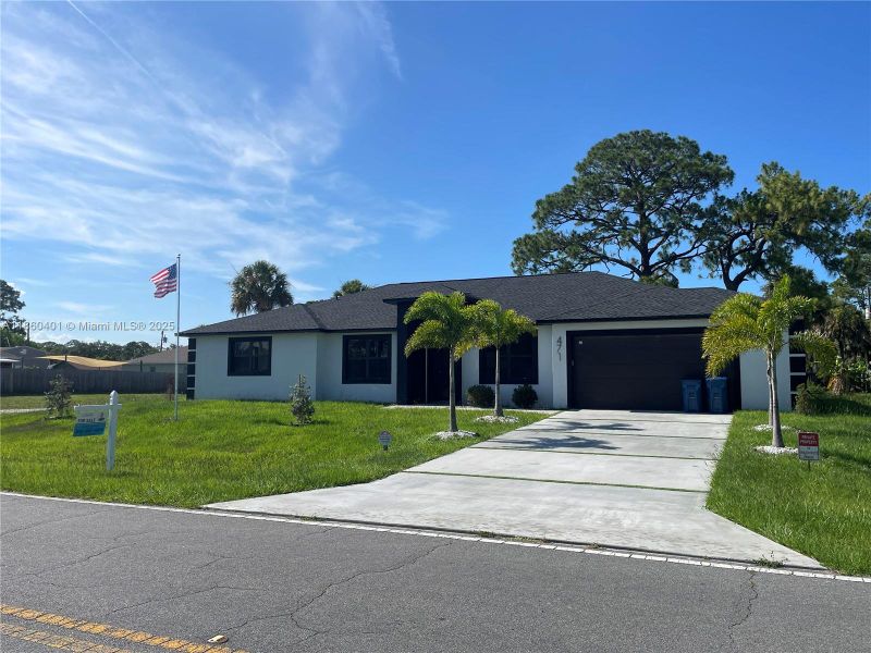 Front exterior of a new home in , Palm Bay, FL, highlighting curb appeal (Image 20).