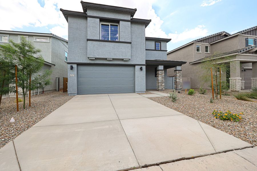 A driveway leading to a house.