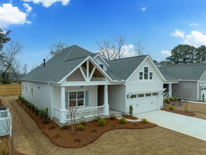 Representative exterior photo of a completed home built from the Kauai by Bill Clark Homes in The Sanctuary at Sunset Beach, Sunset Beach, NC (Image 29).
