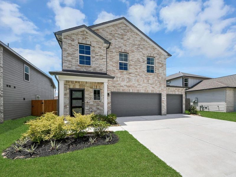 Front exterior of a new home in Hill & Dale Ranch, Splendora, TX, highlighting curb appeal (Image 2).