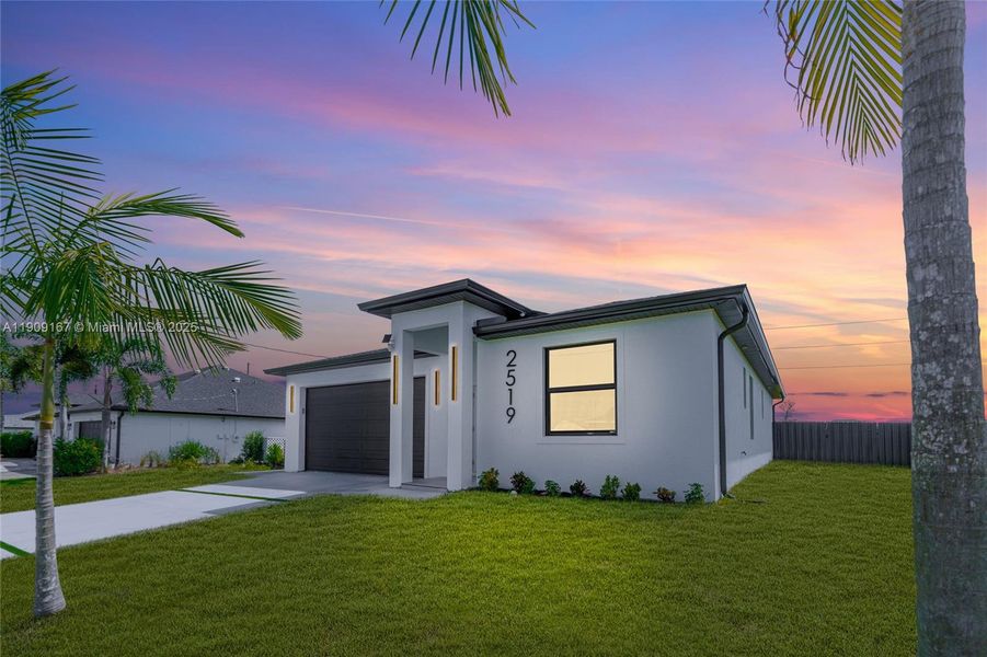 Front exterior of a new home in , Cape Coral, FL, highlighting curb appeal (Image 23). Front exterior of a new home in , Cape Coral, FL, highlighting curb appeal (Image 23).