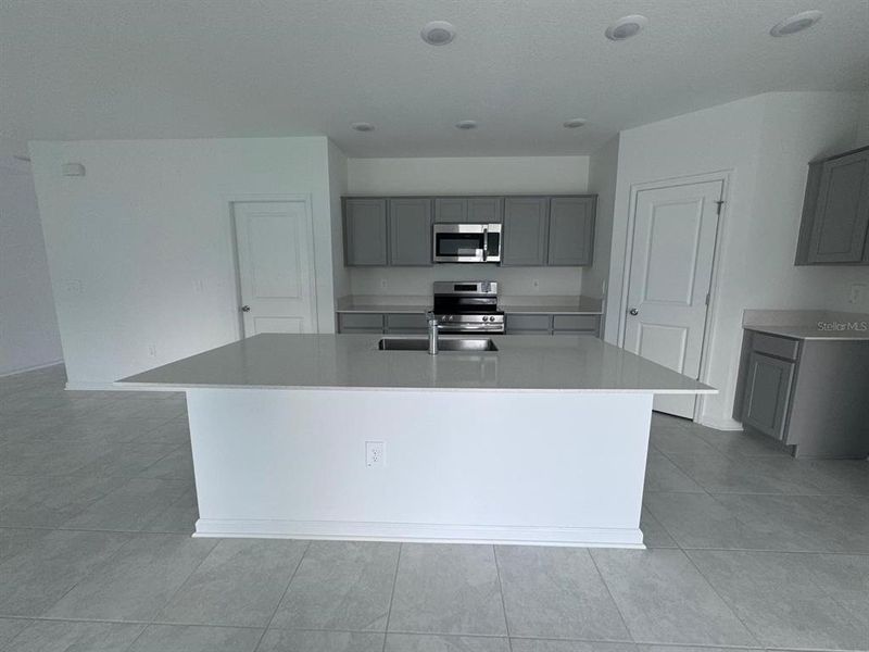 Furnished interior view inside a new home in Peace Creek Reserve, Winter Haven (Image 5).