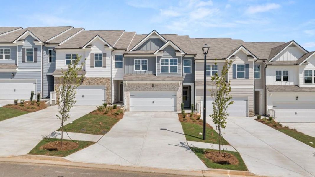 Front exterior of a new home in Rolling Meadows, Jasper, GA, highlighting curb appeal (Image 1). Front exterior of a new home in Rolling Meadows, Jasper, GA, highlighting curb appeal (Image 1).