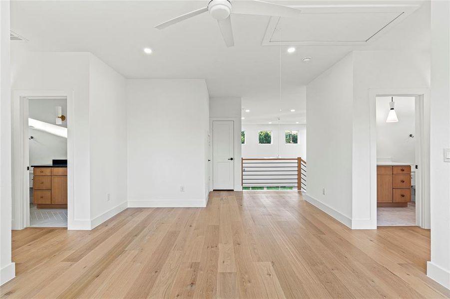 Unfurnished room featuring attic access, recessed lighting, light wood-style floors, and ceiling fan