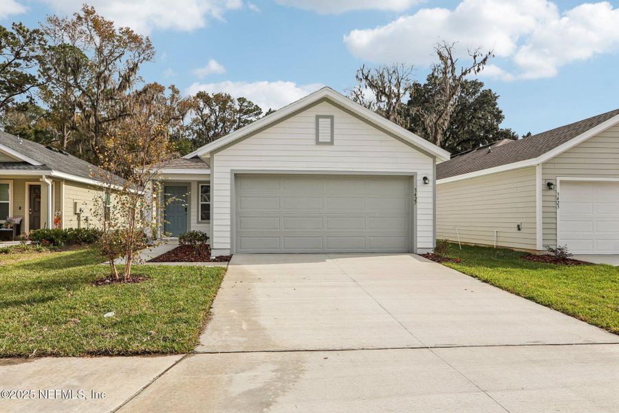 Front exterior of a new home in Kings Landing, Jacksonville, FL, highlighting curb appeal (Image 19). Front exterior of a new home in Kings Landing, Jacksonville, FL, highlighting curb appeal (Image 19).