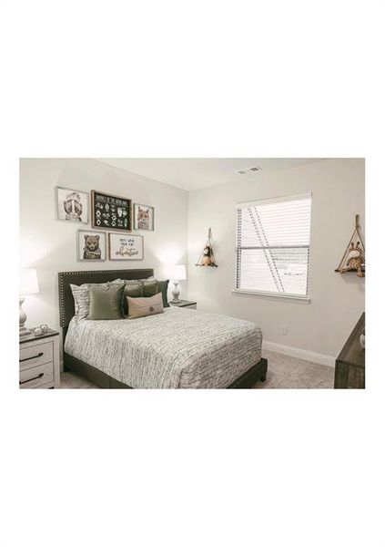 Bedroom featuring carpet floors