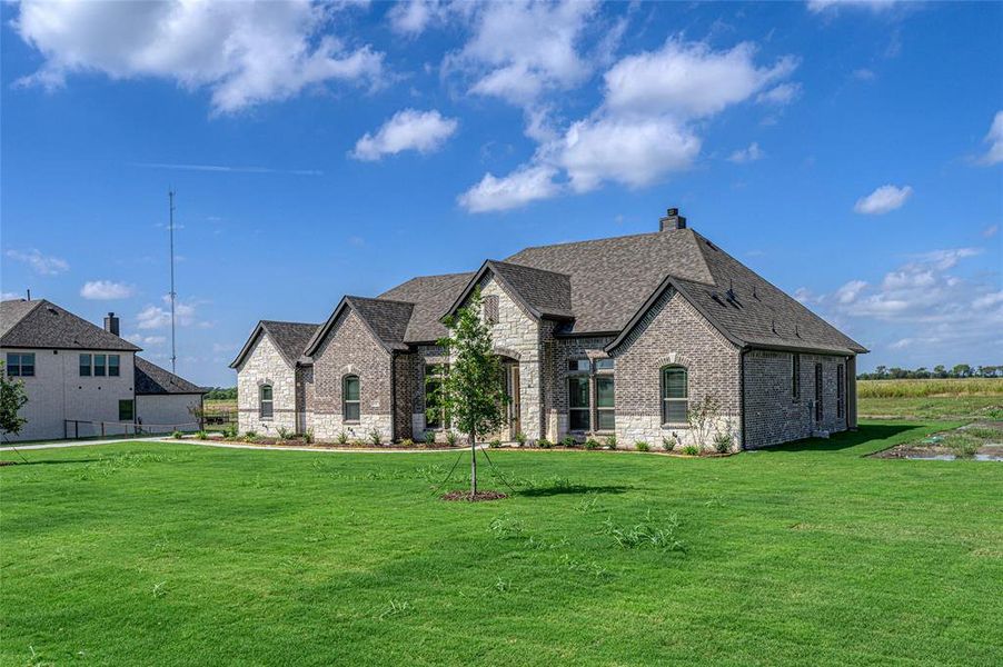 Front exterior of a new home in Pioneer Estates, Blue Ridge, TX, highlighting curb appeal (Image 17). Front exterior of a new home in Pioneer Estates, Blue Ridge, TX, highlighting curb appeal (Image 17).