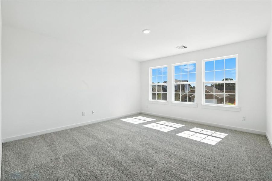 Unfurnished room featuring carpet and baseboards Unfurnished room featuring carpet and baseboards