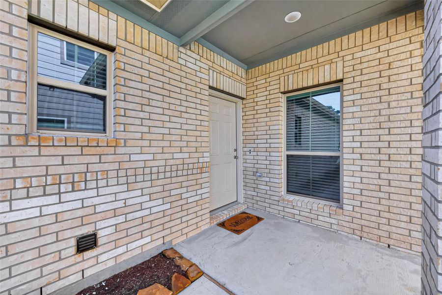 Exterior details and patio area of a home in Woodland Lakes, Huffman (Image 3).