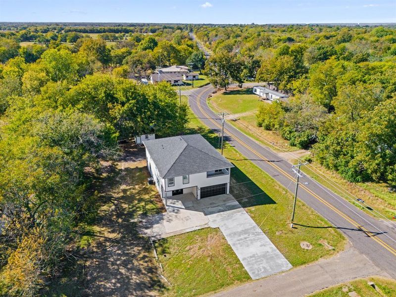 Front exterior of a new home in , Pecan Gap, TX, highlighting curb appeal (Image 2).