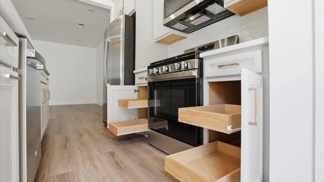 Exclusive kitchen design with abundant storage, quartz countertops, and tasteful finishes throughout located at Marion Square