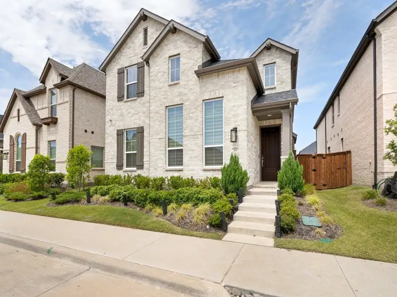 Front exterior of a new home in , Celina, TX, highlighting curb appeal (Image 2). Front exterior of a new home in , Celina, TX, highlighting curb appeal (Image 2).