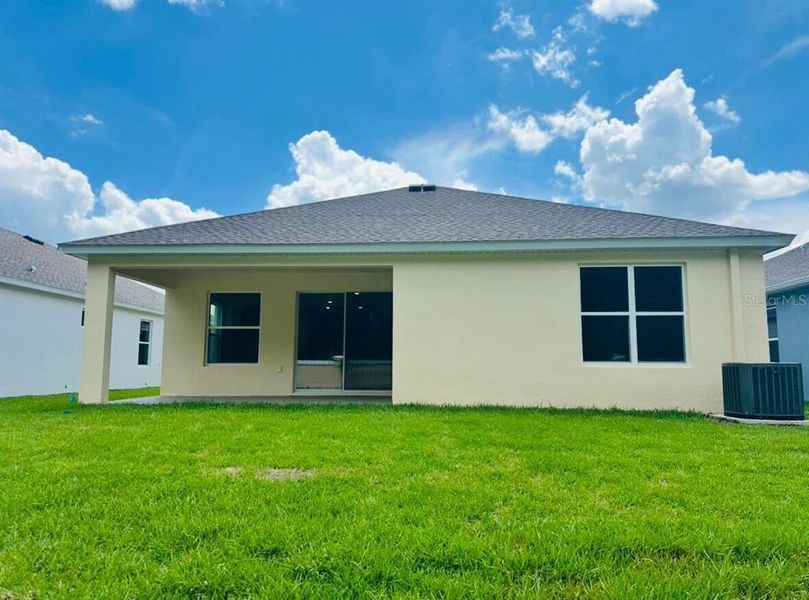 Front exterior of a new home in Cascades at Southern Hills, Brooksville, FL, highlighting curb appeal (Image 1).