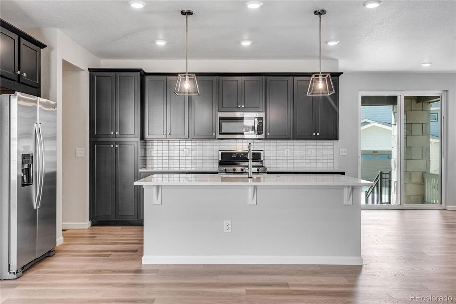Furnished interior view inside a new home in Crescendo at The Aurora Highlands, Aurora (Image 5).