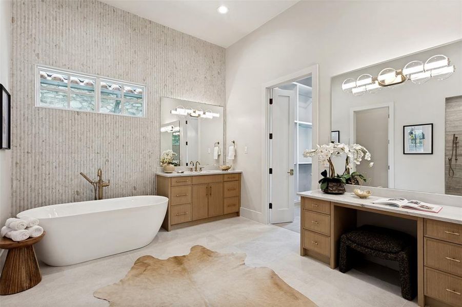 Primary bath is spacious and offers a spa look and feel. Large soaking tub and oversized walk in shower with dual shower heads and a hand held shower.