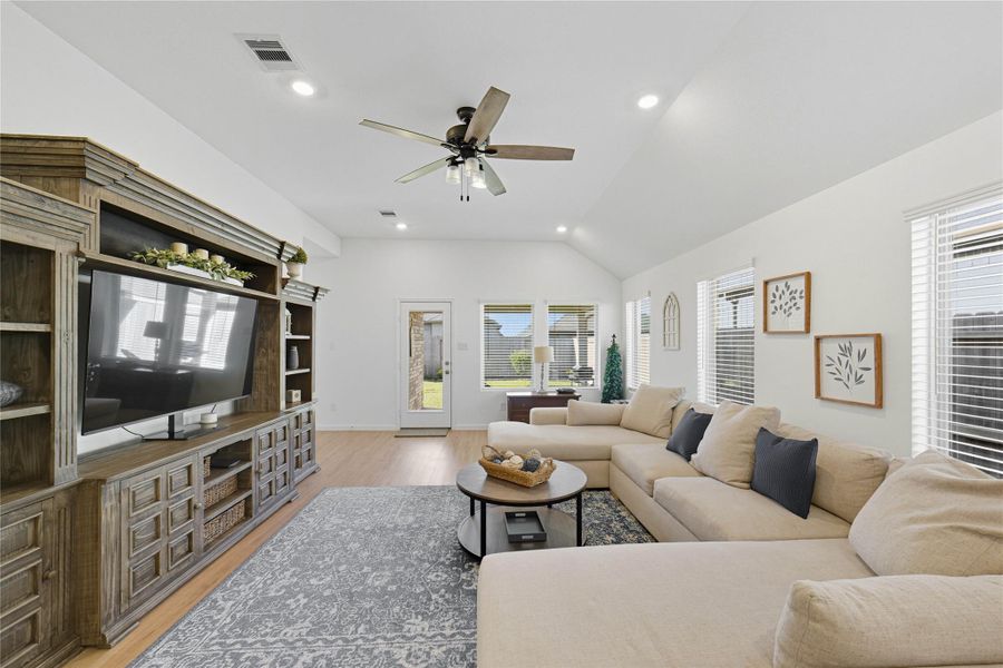 Spacious living room with high ceilings and abundant natural light. Spacious living room with high ceilings and abundant natural light.