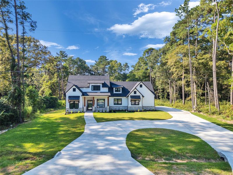 Front exterior of a new home in , Magnolia, TX, highlighting curb appeal (Image 25).