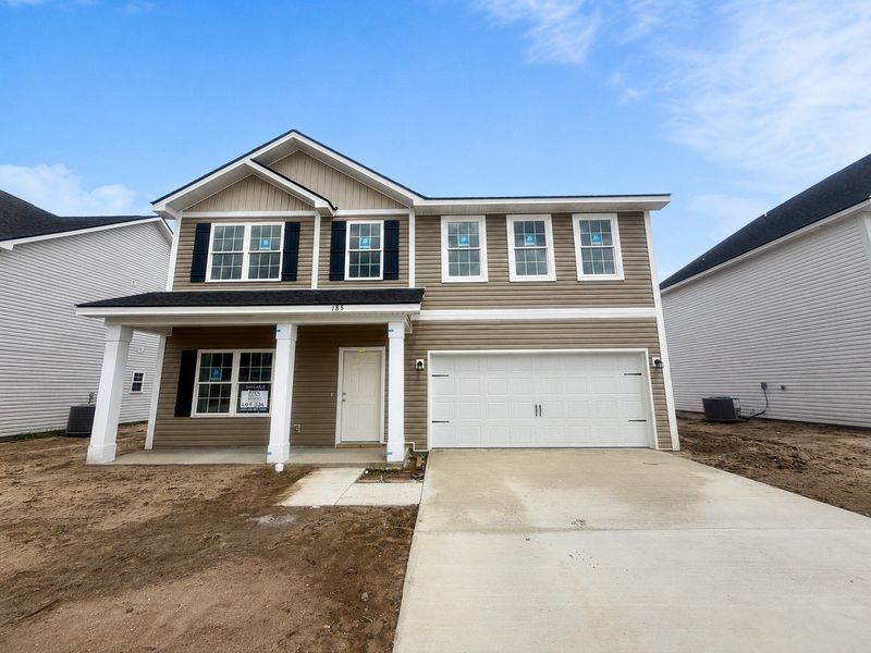Front exterior of a new home in Tranquil South, Hinesville, GA, highlighting curb appeal (Image 1). Front exterior of a new home in Tranquil South, Hinesville, GA, highlighting curb appeal (Image 1).