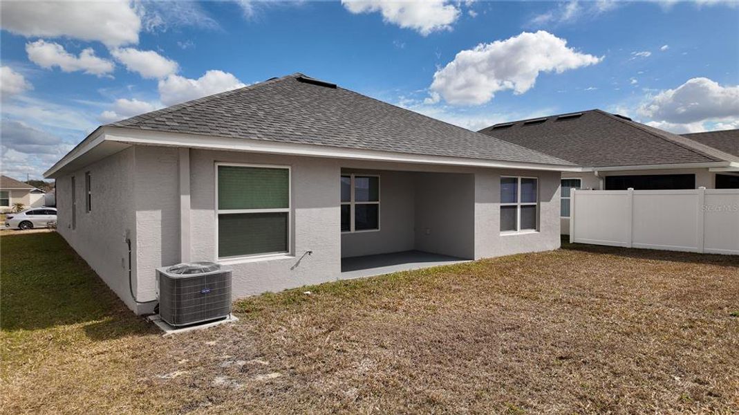 Exterior details and patio area of a home in Pine Bluff, Spring Hill (Image 28).
