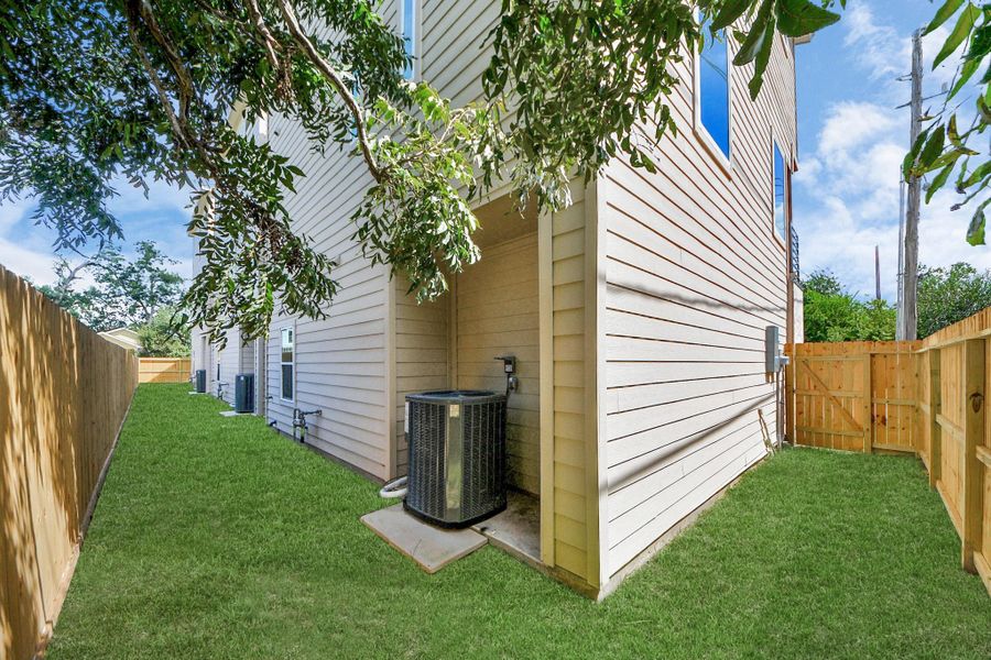 Extended wrap-around yard offering additional fenced outdoor area