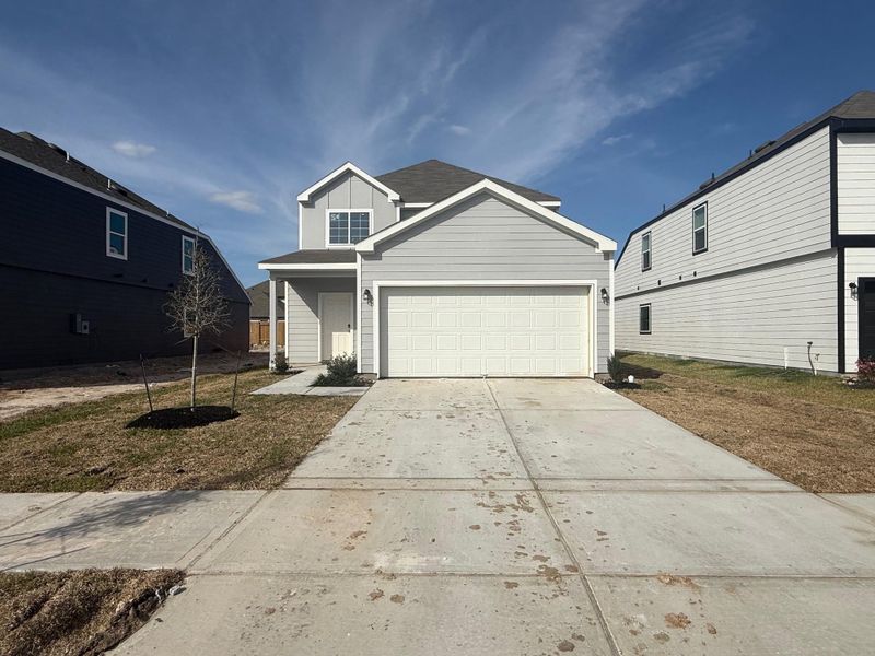 Front exterior of a new home in Wayside Village, Houston, TX, highlighting curb appeal (Image 2). Front exterior of a new home in Wayside Village, Houston, TX, highlighting curb appeal (Image 2).