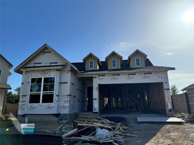 Property under construction featuring a garage