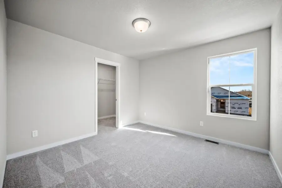 Spacious, unfurnished interior of a new home in The Glen, Colorado Springs (Image 22).