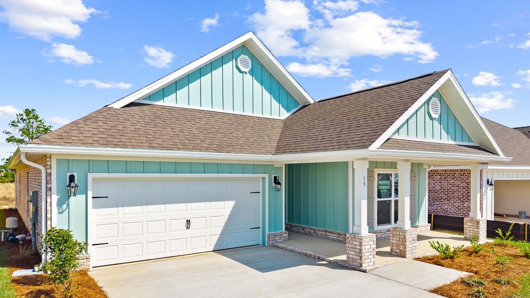 Front exterior of a new home in Owl's Head Farms, Freeport, FL, highlighting curb appeal (Image 22).
