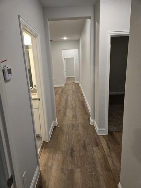 Hallway featuring dark hardwood / wood-style floors