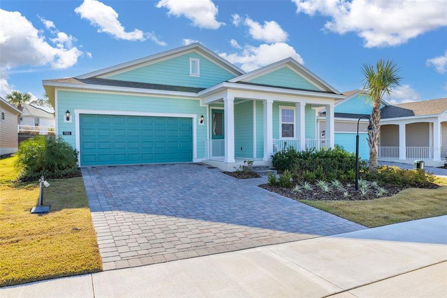 Front exterior of a new home in Green Key Village, Lady Lake, FL, highlighting curb appeal (Image 2).