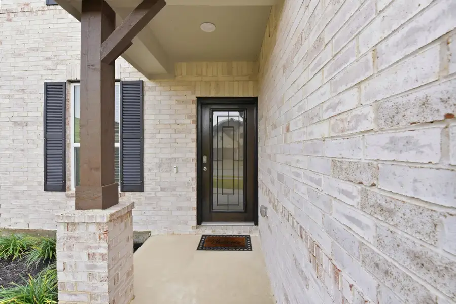 Exterior details and patio area of a home in Sunterra North, Katy (Image 4).