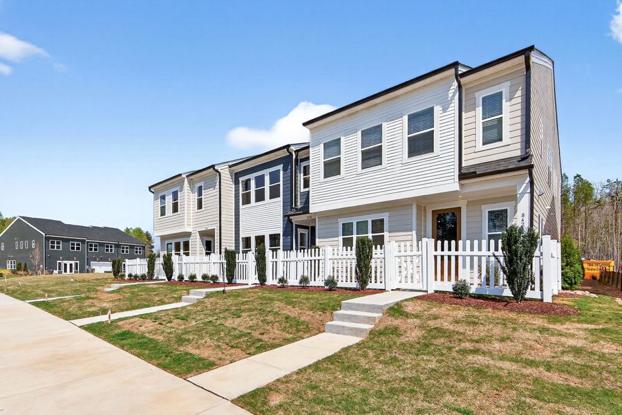 Front exterior of a new home in Ellis Townes, Charlotte, NC, highlighting curb appeal (Image 2). Front exterior of a new home in Ellis Townes, Charlotte, NC, highlighting curb appeal (Image 2).