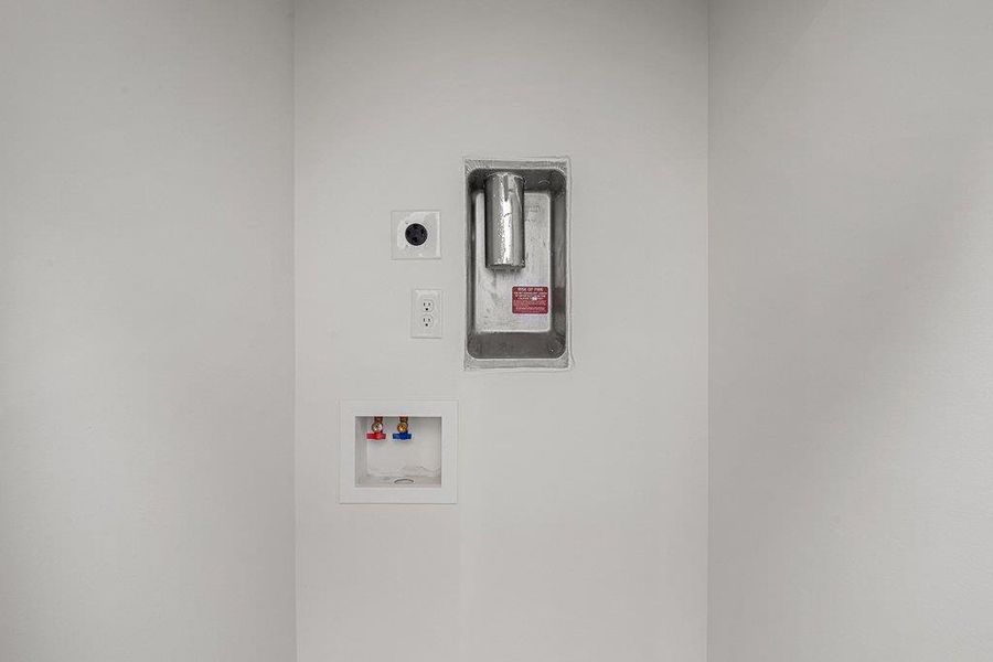 Laundry area featuring hookup for a full size washer and dryer. (stackable)