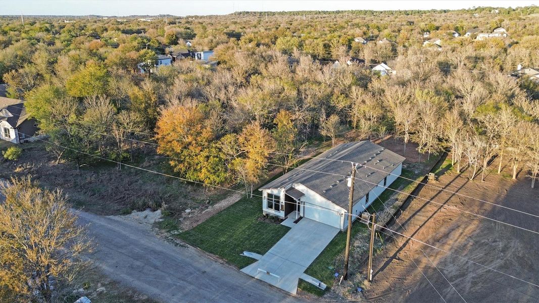 Front exterior of a new home in , Bastrop, TX, highlighting curb appeal (Image 21).