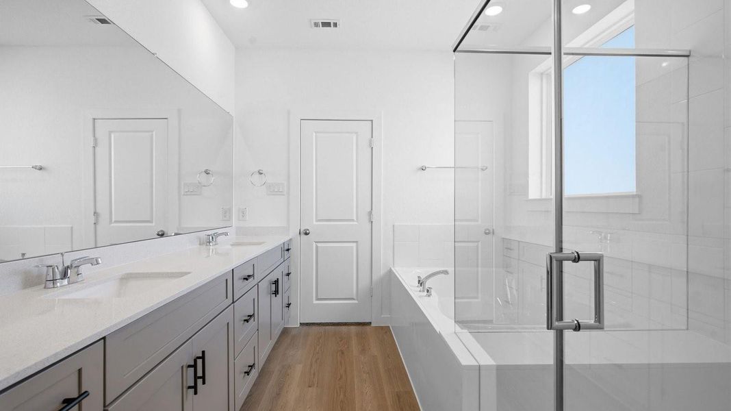 Kitchen adorned with painted cabinets seamlessly integrated into an open dining area layout.