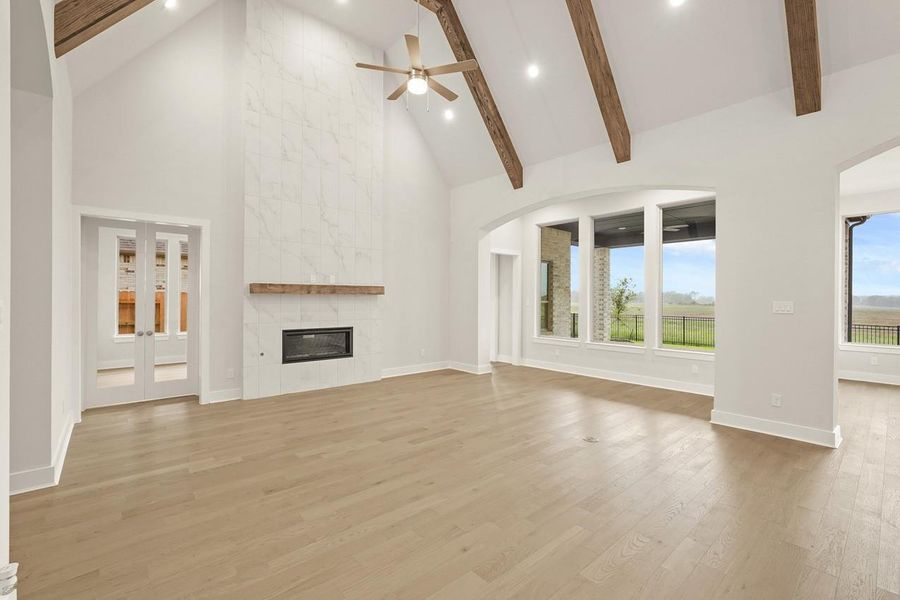 Family Room with Tile Fireplace, Wood Beams, with access to Study & Gameroom