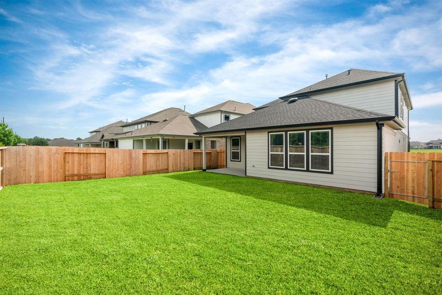 Sample photo of completed home with similar floor plan. As-built interior colors and selections may vary.  Typical backyard.