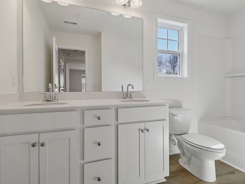 Furnished interior view inside a new home in Providence Station at Trolley Run, Aiken (Image 13).