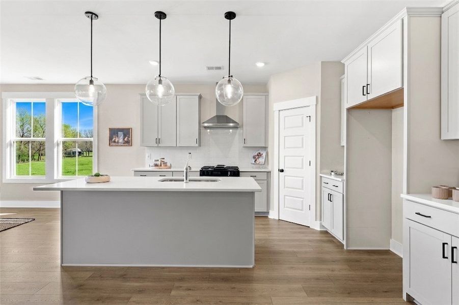 This bright kitchen features a spacious island and