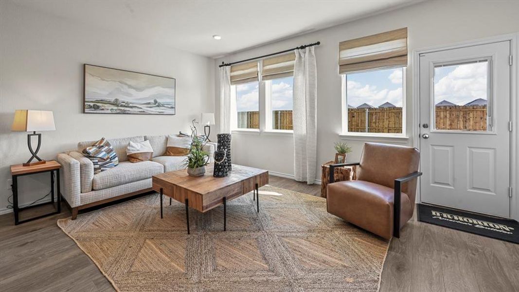Living room featuring wood finished floors and baseboards