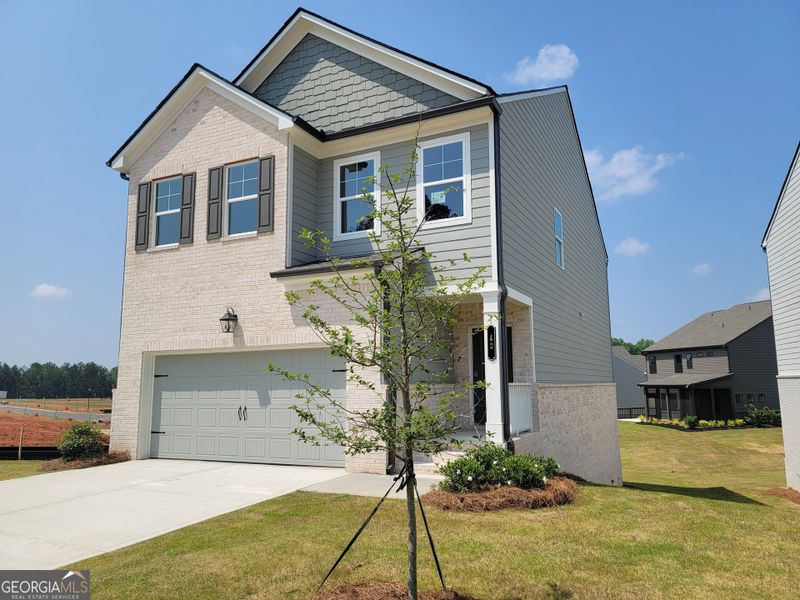 Front exterior of a new home in Kentmere, Auburn, GA, highlighting curb appeal (Image 2).