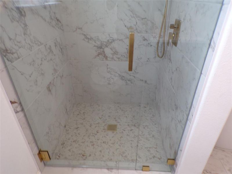 Bathroom featuring tiled shower