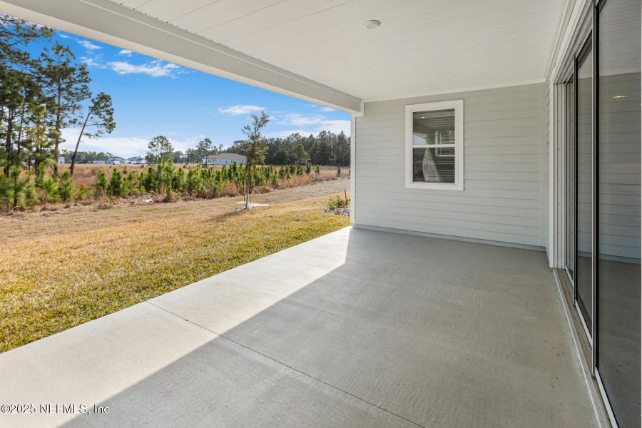 Exterior details and patio area of a home in Lakes at Bella Lago, Green Cove Springs (Image 3).