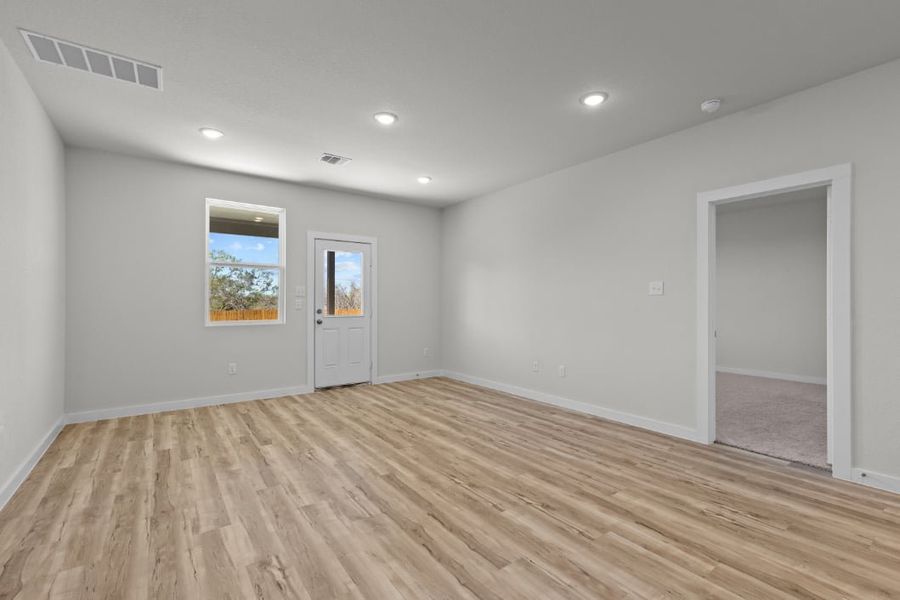 A room with a wood floor and a wood floor. A room with a wood floor and a wood floor.