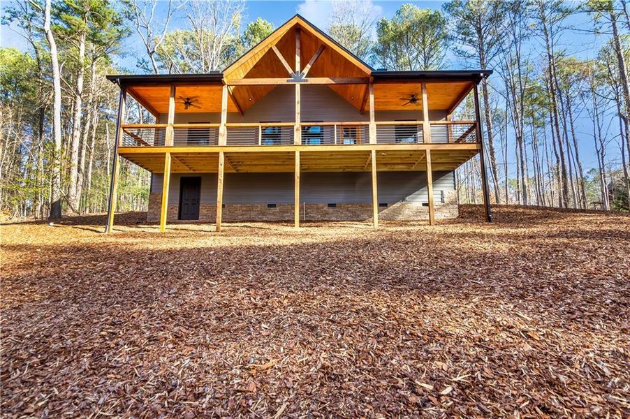 Exterior details and patio area of a home in , Ellijay (Image 29).